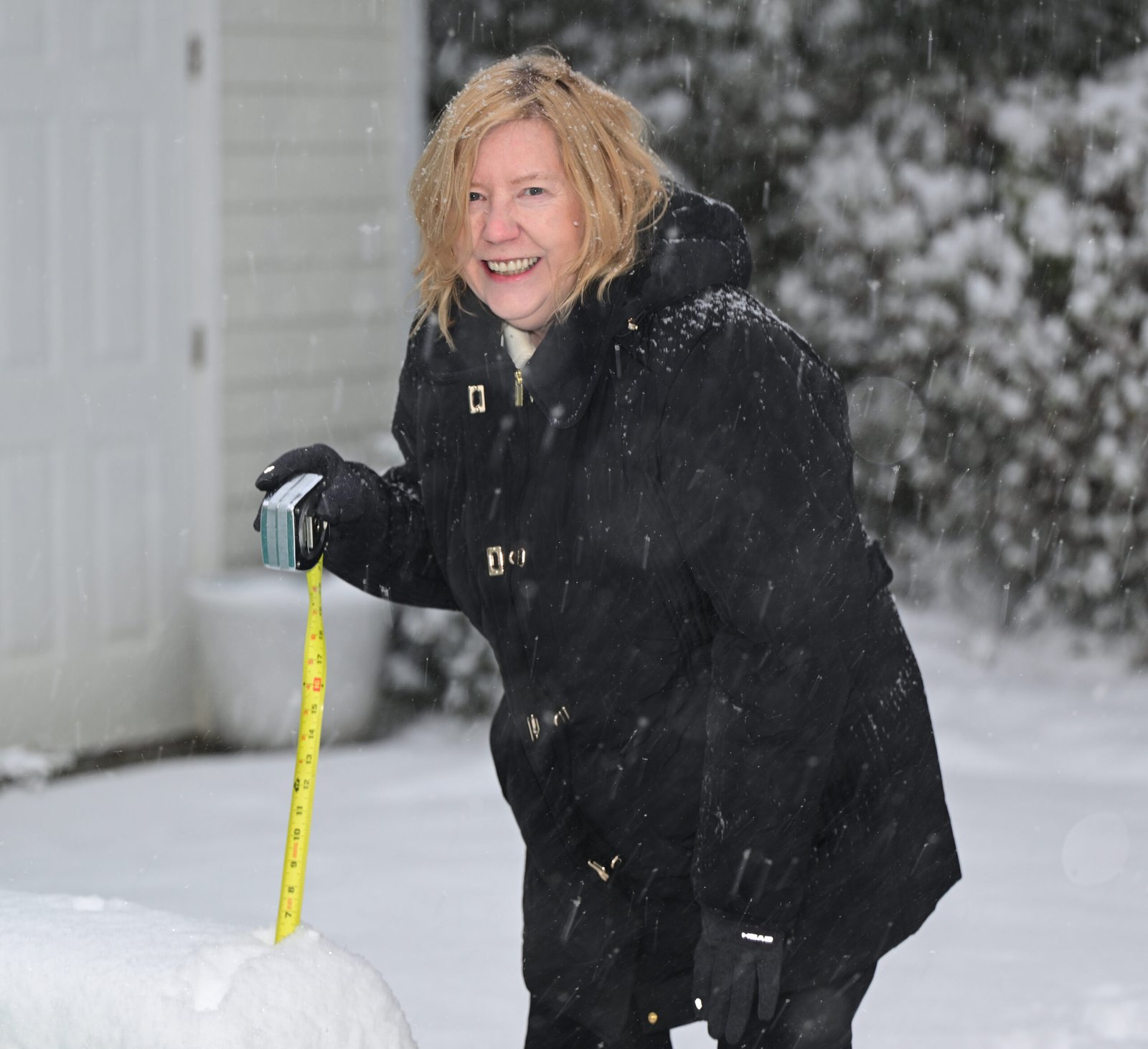 Colleen Black measures Fairhope's snowfall