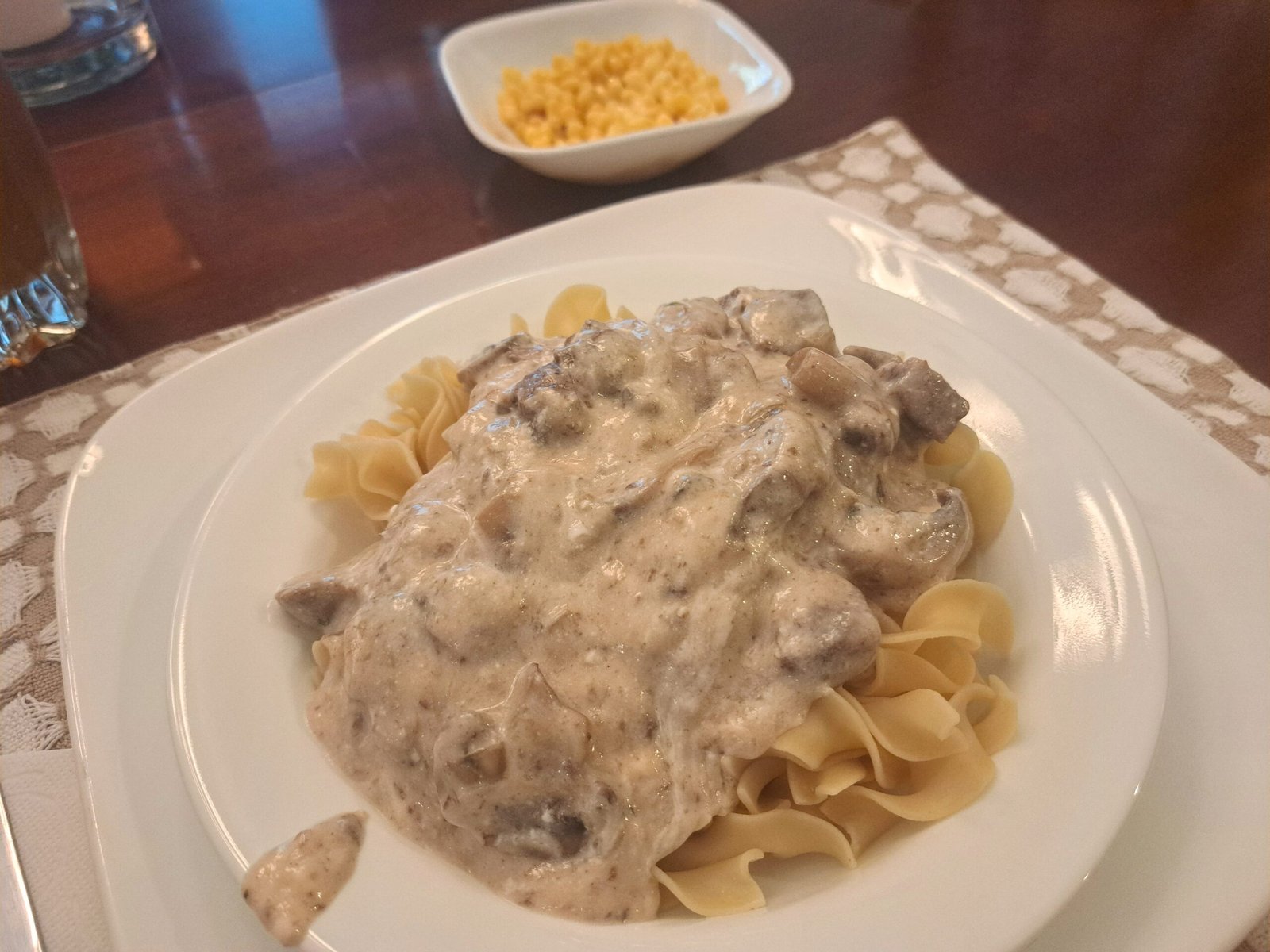 Steak tips over noodles