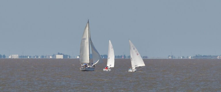 Sailboats take advantage of a light breeze on Mobile Bay