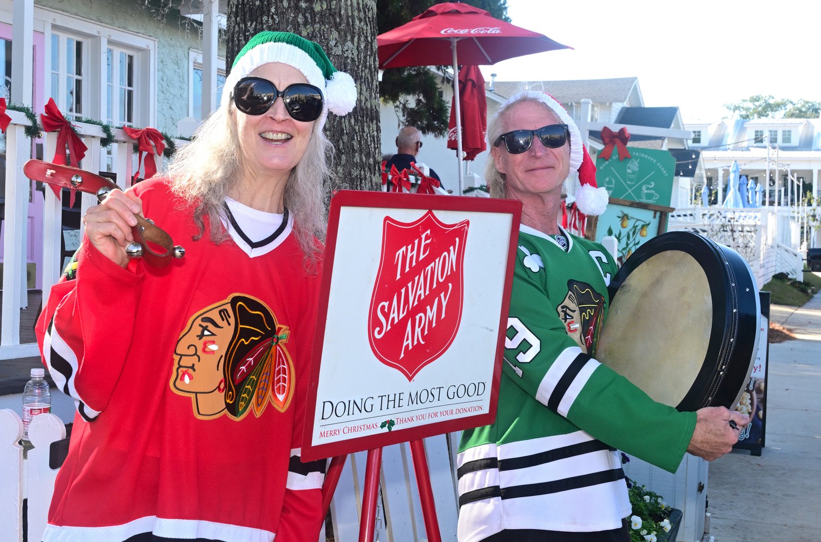 Jefferson and Kelly Moore ring the Salvation Army Christmas bell in Fairhope